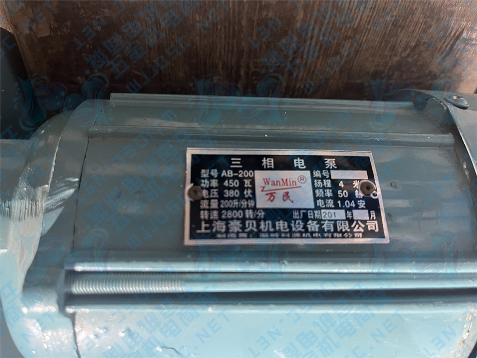 1725611223314705.jpg 万民机床泵AB-200标牌.jpg